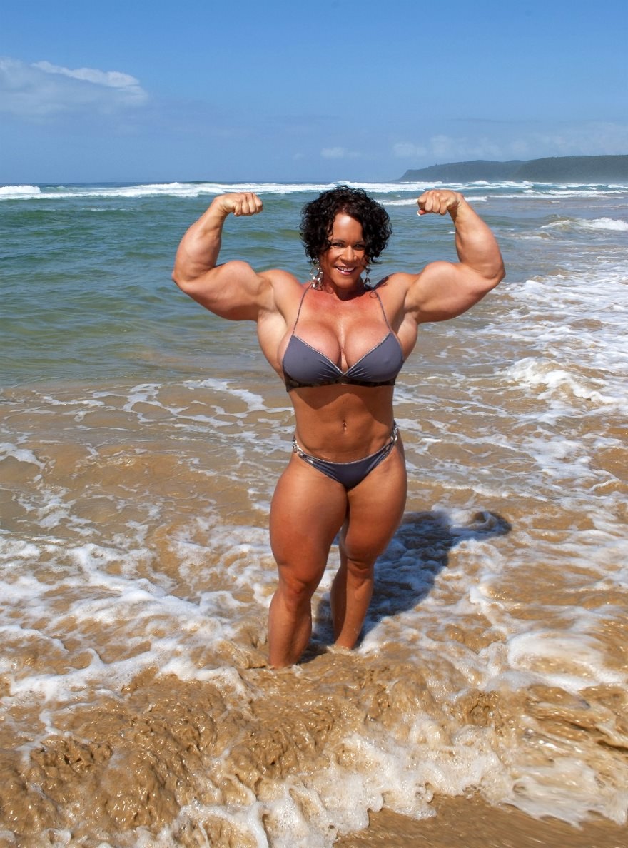 Truly huge bodybuilder flexing her muscles