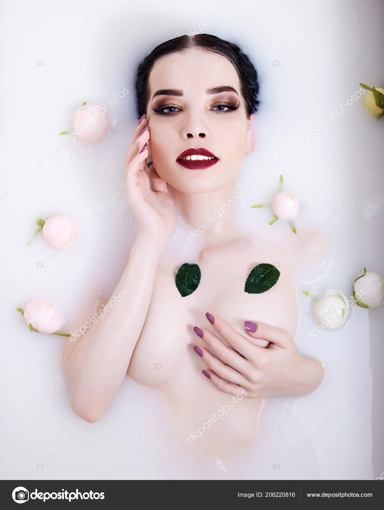 Nude girl in milk bath