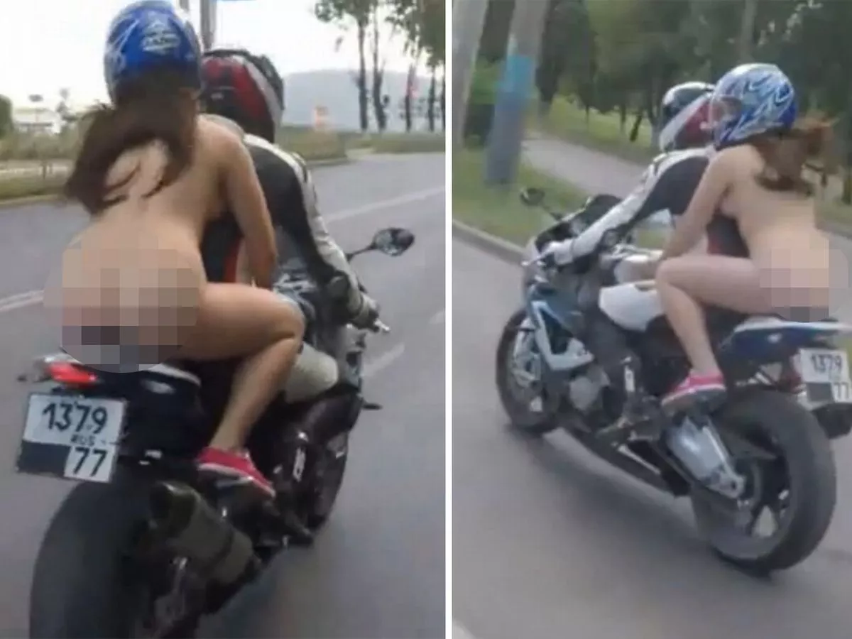 Woman riding motorcycle nude