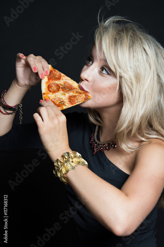Black girl eating pizza