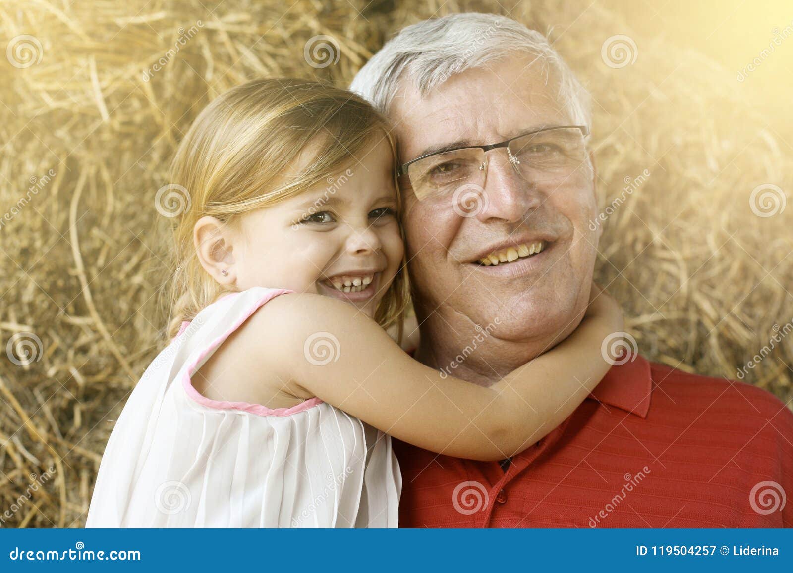 Very young girl and grandpa