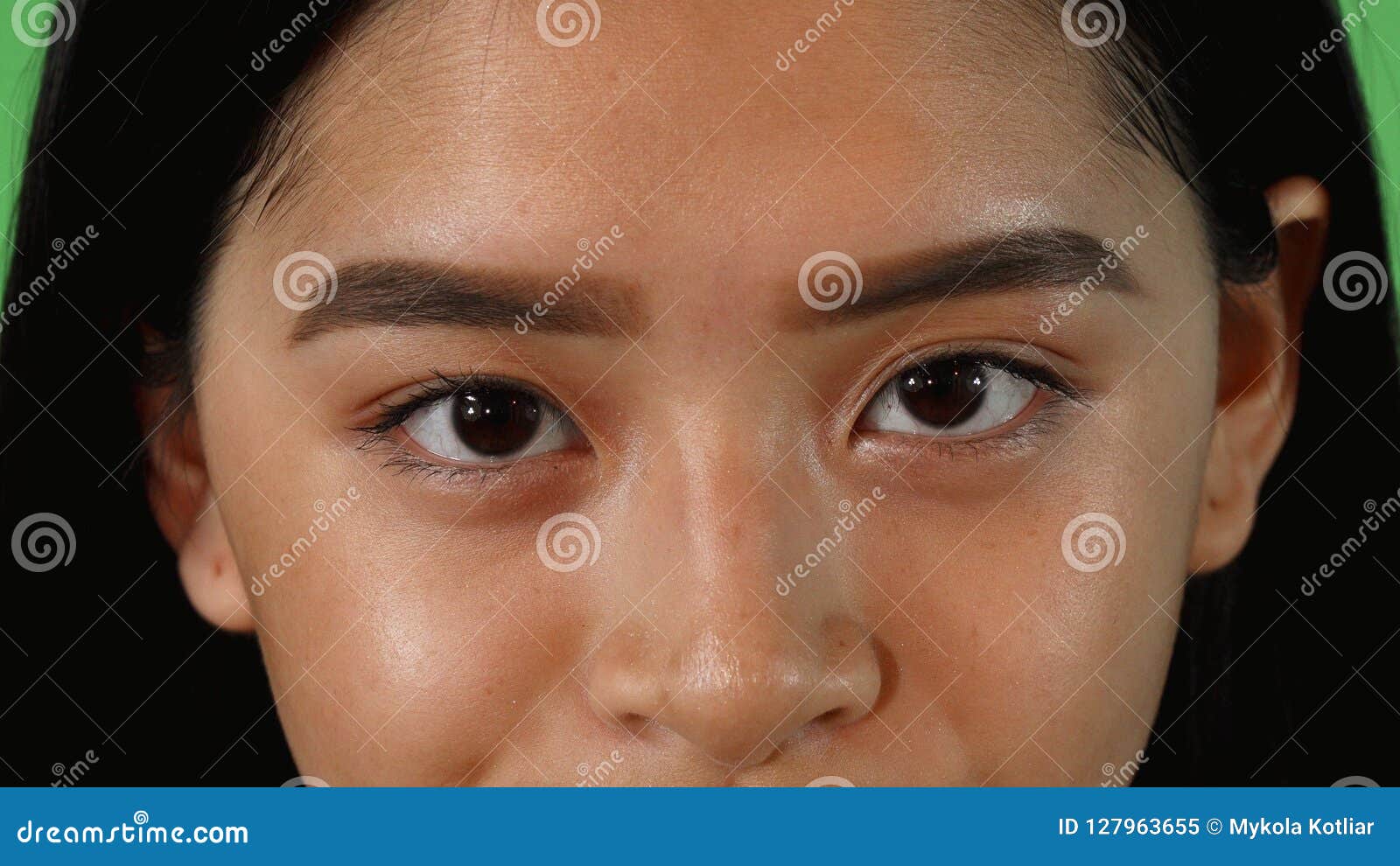 Asian woman with green eyes