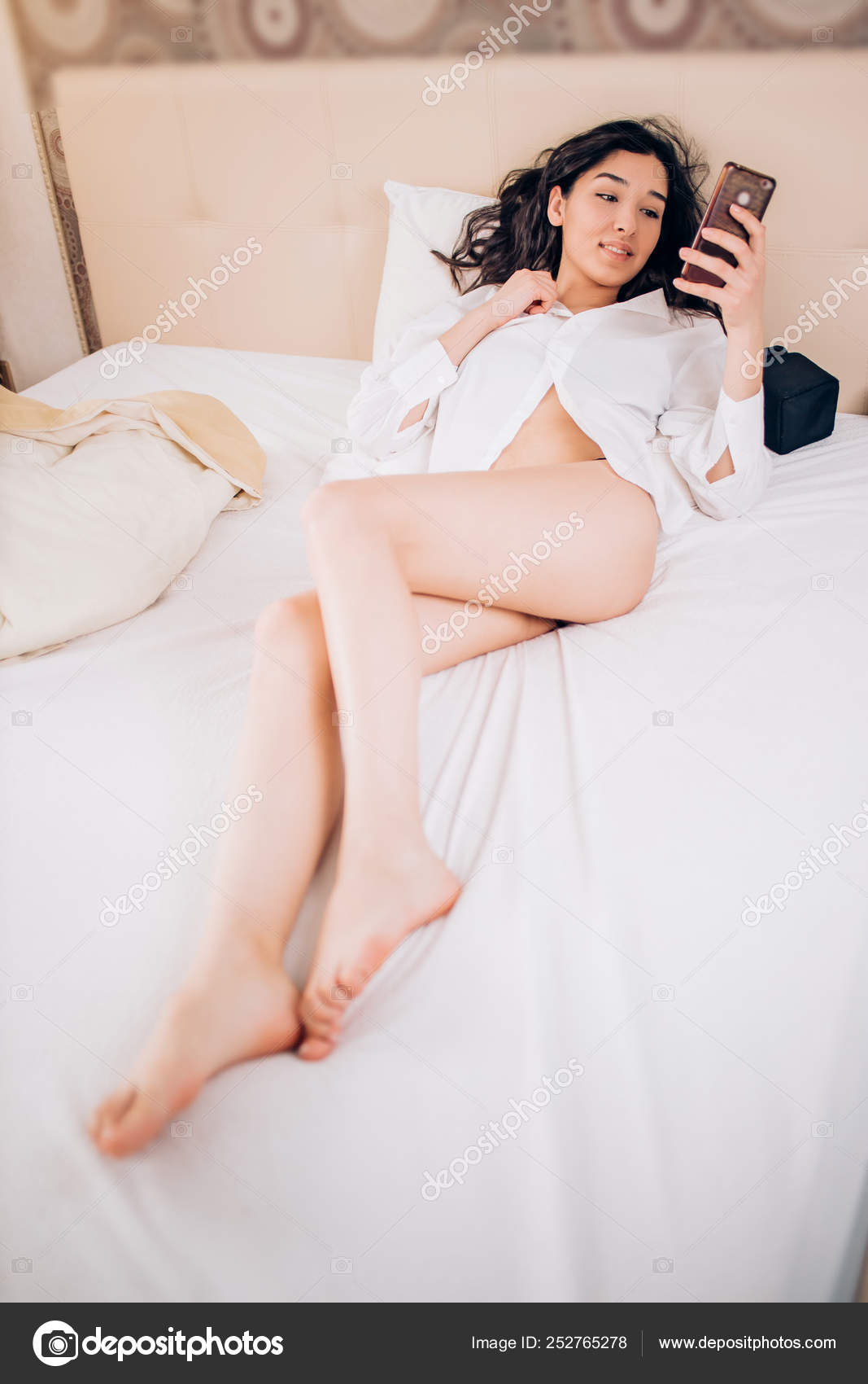 Half naked woman in bedroom