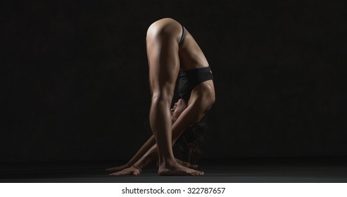Flexible nude girl bent over